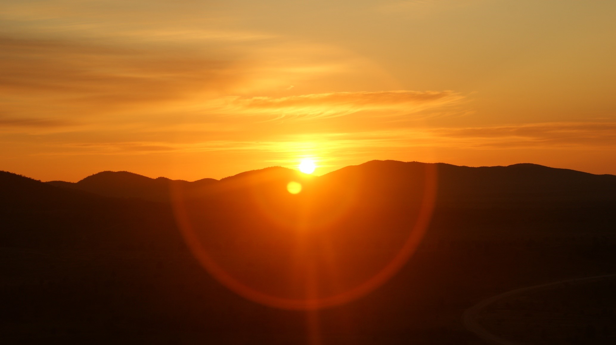 Name: Janay. Prize: Shortlist. When observing the glorious sunrise captured over the Flinders Ranges, two concentric circles are seen. Formed through a lens flare, the circles share an origin point, but differing radii. Nonetheless, they share a squared relationship.